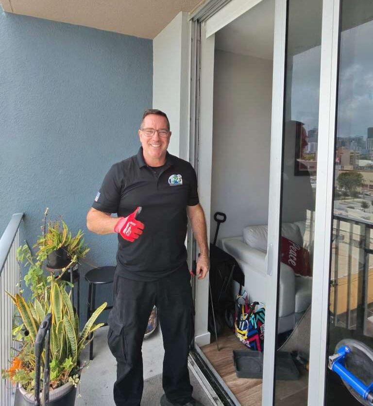 Sliding Doors Pro technician after completing sliding door repair in Broward County