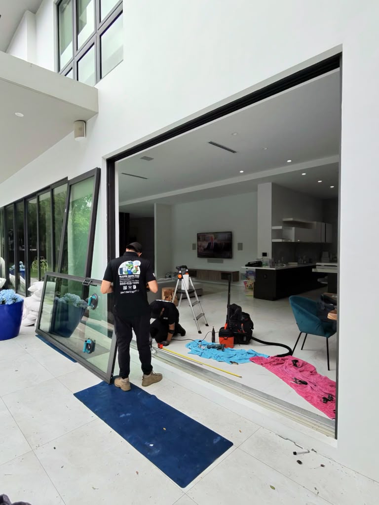 Sliding Doors Pro removing oversized sliding glass door panel for repair in South Florid